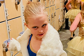 The author’s young daughter backstage at a dance recital.