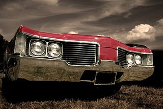 red car with sepia background