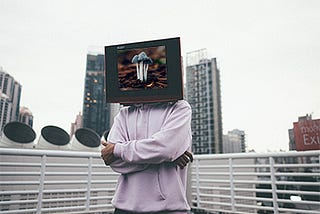 Man with a television head displaying magic mushrooms