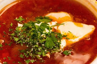 Close up picture of a bowl of borscht