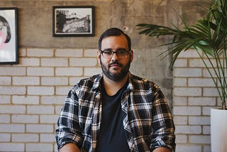 A guy smiling at the camera.