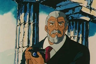 imagem: mitsumasa kido com câmera fotográfica em ruínas gregas.