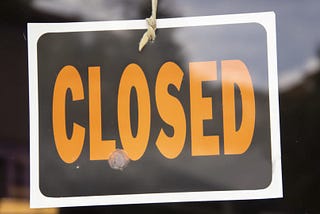 closed sign on a business