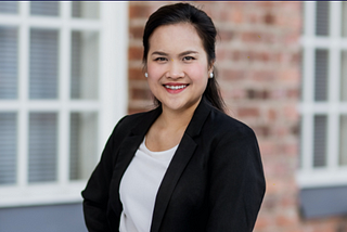 Image of woman in business jacket.