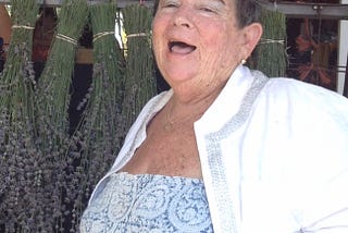 My beautiful friend Judy in front of a rack of freshly cut lavender