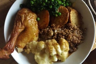 Roasted chicken with cauliflower cheese, buckwheat stuffing, roast potatoes and sautéed spinach and peas.