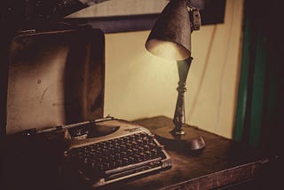 Desk Lamp Lightened the Gray Typewriter on Wooden Table