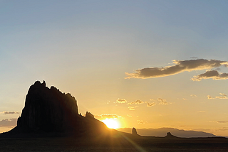 A sunset portrait of Shiprock, New Mexico.