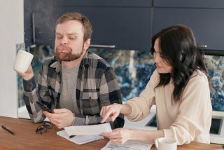 Man spilling his coffee after seeing shocking thing.