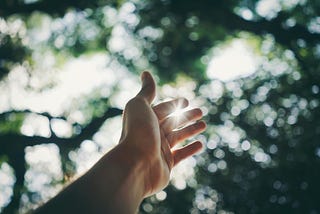 Selective focus of a hand reaching out