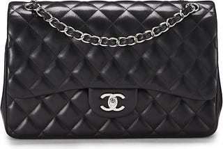 Chanel Pre-Loved Black Quilted Lambskin New Classic Double Flap Jumbo: A Timeless Investment