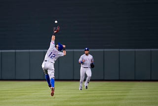 Texas Rangers second baseman Rougned Odor attempts to catch a baseball in a 2017 game at the Baltimore Orioles.