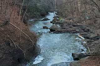 View of the woods and water from the top of a viaduct