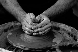 potter making a pot