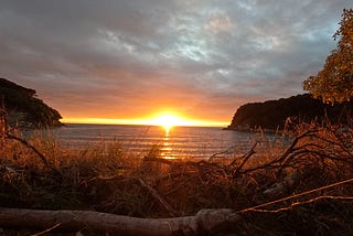 Waking up to the Rising Sun Above the Ocean