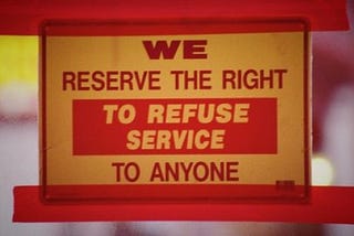 door sign: “we reserve the right to refuse service to anyone”