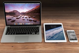 Photo of MacBook, iPad, and iPhone. Photo by Pixabay: https://www.pexels.com/photo/macbook-pro-beside-white-ipad-4158/