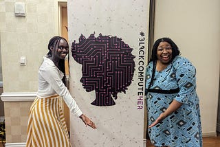 a sign with the logo of blackcomputeHER with a black woman on each side