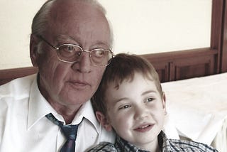 Picture of the author as a child with their grandfather