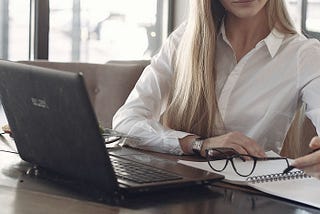 woman preparing for GRE in front of a laptop