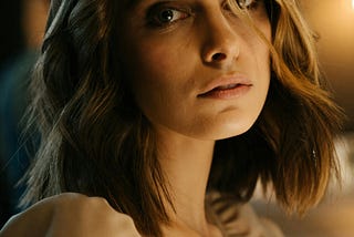 Pensive woman gazing at the camera