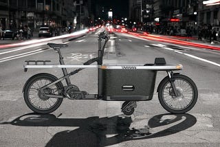 A view of the Tarran T1 Pro electric cargo bike in an urban setting.