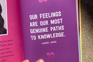 Photo of a book page that includes the quotation from Audre Lorde “Our feelings are our most genuine paths to knowledge.”