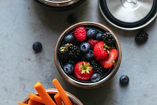 fresh fruits and veggies, cut up in containers