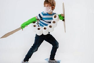 boy dressed as a toilet paper knight