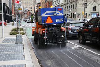 Brine truck treating a bike lane