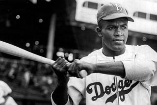 Jackie Robinson, famous Civil Rights activist and baseball player, at the plate in a Brooklyn Dodgers jersey