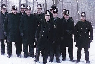 Group of British Police officers in snowy weather