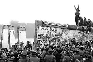 Celebrate the fall of the Berlin Wall by fighting to tear down others