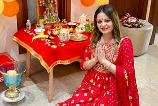 Woman praying to Lord Ganesha