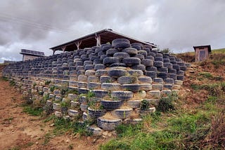 How Building a 530-Tire Retaining Wall Saved Me ~$13,000 — and how to do it!