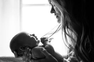 black and white photo of mother and baby
