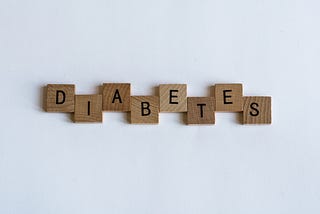 Brown-colored blocks collectively spelling “diabetes”.