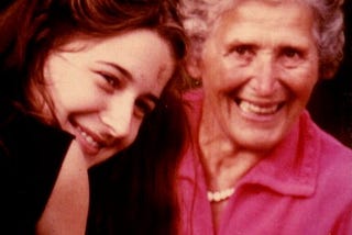 An older woman and a younger woman smiling for the camera