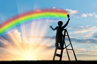 Child on ladder painting a rainbow before a bright sunrise