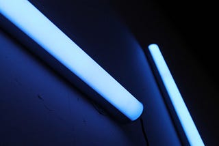 How does a tube light work? and what is flickering?