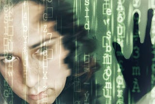 A slightly blurred face of an insanely beautiful light-skinned autistic transgender woman, superimposed with vertical green lines of code on a dark background. Beside her, to the right, is thesilhouette of a hand,pressing against the code as if it were a barrier it sought to escape.