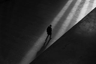 Photo by Bob Price from Pexels — Lonely Man. UX designer walking alone.