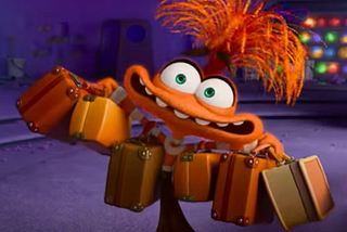 Anxiety from Inside Out Two. He is an orange guy that looks like he has ostrich feathers as hair.