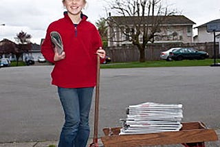 Girl delivering newspapers