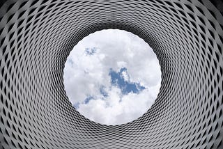 Photo by Pixabay: https://www.pexels.com/photo/low-angle-photography-of-grey-and-black-tunnel-overlooking-white-cloudy-and-blue-sky-210158/