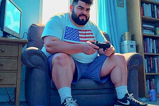 A fat man wearing an American flag shirt