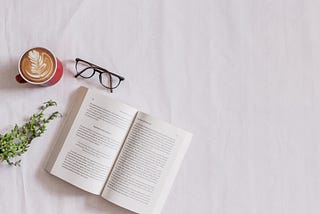 Book and glasses on a table