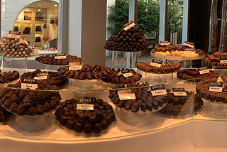 A store display featuring different types of chocolate. It’s remarkable. You want to bring everything home.