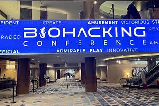 Electronic banner displayed in the main entry of the convention center for the Biohacking Conference in Orlando.