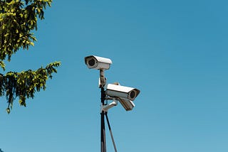 Two surveillance cameras collect video footage.